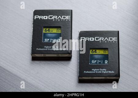 Two ProGrade SD cards, with packaging, on a silver background Stock Photo