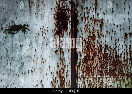 Old grunge rusty metal texture with scratches and crack. Vintage dark rustic metal background. Stock Photo