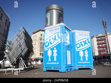 Cologne, Germany. 23rd Feb, 2022. Barrier fences and mobile toilet cabins stand in front of the party mile Zülpicher Straße In Cologne, only vaccinated fools with an additional negative test or booster vaccination are to be allowed to celebrate carnival. The entire city area is declared a 'customs zone.' As a result, the 2G-plus rule will apply throughout Cologne on Carnival days. Credit: Oliver Berg/dpa/Alamy Live News Stock Photo