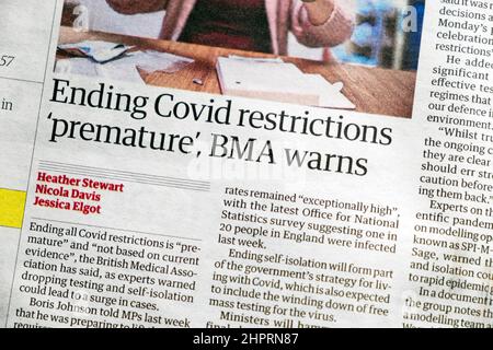 'Ending Covid restrictions 'premature,' BMA warns' Guardian pandemic newspaper headline article clipping cutting on 19 February 2022 London England UK Stock Photo