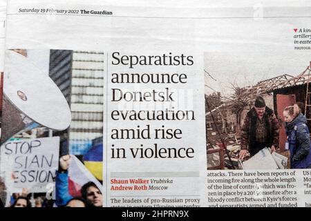 'Separatists announce Donetsk evacuation amid rise in violence' Guardian newspaper headline Ukraine Russia article clipping 19 February 2022 London UK Stock Photo