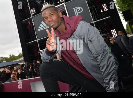 French International football player Paul Pogba attends the launch of the Adidas Football X Paul Pogba Capsule Collection in front of the Eiffel Tower Stock Photo