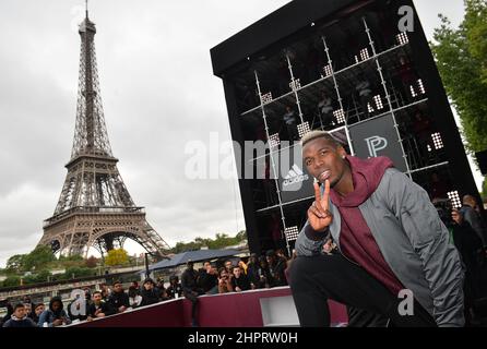 French International football player Paul Pogba attends the launch of the Adidas Football X Paul Pogba Capsule Collection in front of the Eiffel Tower Stock Photo