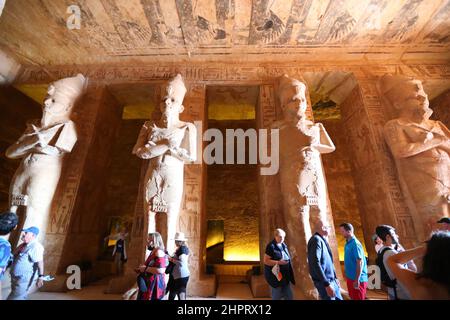 CAIRO, Feb. 23, 2022 (Xinhua) -- Tourists visit the Great Temple of Abu Simbel in Aswan, Egypt, Feb. 22, 2022. Abu Simbel temple complex consists of two massive rock-cut temples in southern Egyptian Aswan. On Feb. 22 and Oct. 22, the rays of the sun would reach and illuminate the sculptures on the back wall. (Xinhua/Sui Xiankai) Stock Photo