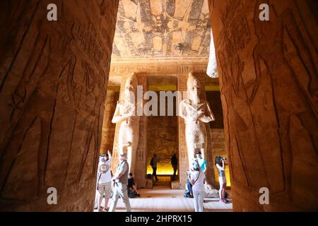 CAIRO, Feb. 23, 2022 (Xinhua) -- Tourists visit the Great Temple of Abu Simbel in Aswan, Egypt, Feb. 22, 2022. Abu Simbel temple complex consists of two massive rock-cut temples in southern Egyptian Aswan. On Feb. 22 and Oct. 22, the rays of the sun would reach and illuminate the sculptures on the back wall. (Xinhua/Sui Xiankai) Stock Photo