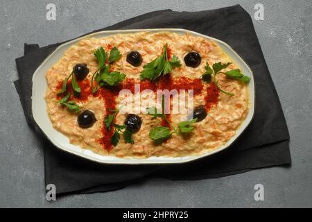 Carrot Tarator in Ceramic Plate. Traditional Appetizer. Ready to Eat and Serve. Traditional delicious Turkish foods; Fresh carrot salad with garlic yo Stock Photo