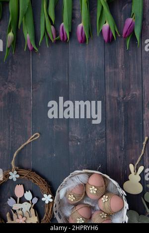A high angle view of easter decorations and tulips Stock Photo