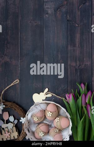 A high angle view of easter decorations and tulips Stock Photo