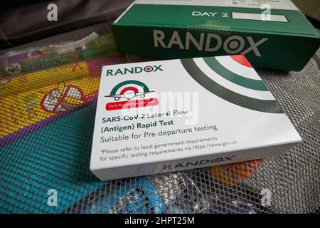 pre-departure lateral flow rapid antigen test and day 2 pcr Covid-19 test kits for travel for unvaccinated people returning to the uk Stock Photo