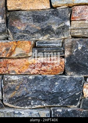 Walls made of multicolor stones , Stone background. Ancient stone wall. Grunge stone wall backdrop. Background of old vintage stone wall. Wall decorat Stock Photo