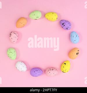 Creative circle copy space frame for Easter made with eggs on pastel pink background. Flat lay minimal. Stock Photo