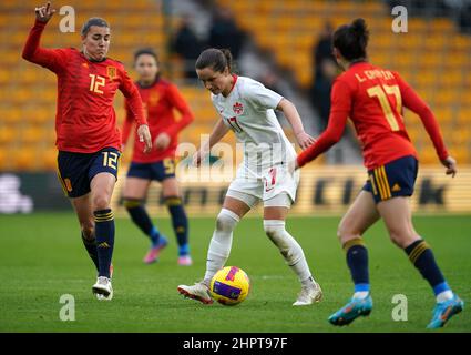 Spain's Patricia Guijarro Gutierrez, Canada's Jessie Fleming and Spain's Luis Garcia Cordoba (left-right) battle for the ball during the Arnold Clark Cup match at Molineux Stadium, Wolverhampton. Picture date: Wednesday February 23, 2022. Stock Photo