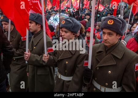 Moscow, Russia. 23rd of February, 2022 People take part in a rally held by the Russian Communist Party on Revolution square on Defender of the Fatherland Day in the center of Moscow city, Russia Stock Photo