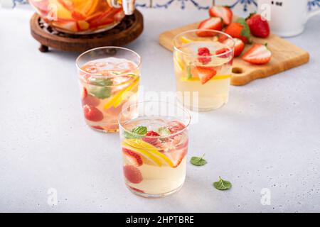 Summer sangria punch in a pitcher and glasses Stock Photo