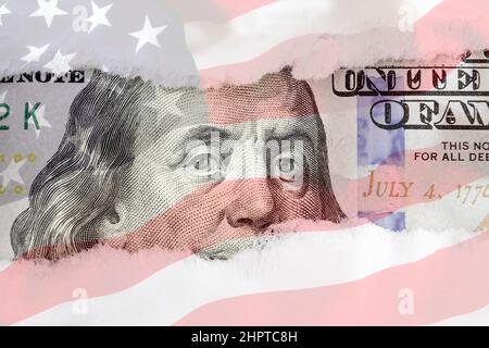 Benjamin Franklin's eyes from a fragment of new 100 dollar with american flag background. Benjamin Franklin. Hundred dollar bill close-up fragment Stock Photo