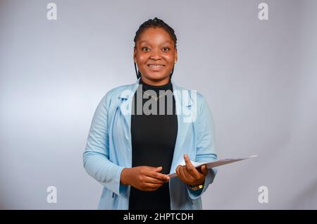 Beautiful African travel agent smiling Stock Photo