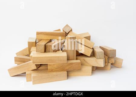 Big pile of wooden blocks, game of Jenga. Fallen tower, game over, isolated on white Stock Photo