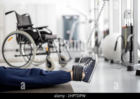 Man doing exercises on decompression simulators for recovery Stock Photo