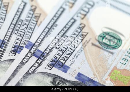 One Hundred Dollars notes close-up photo with selective focus. USD, The United States official currency, financial background photo Stock Photo