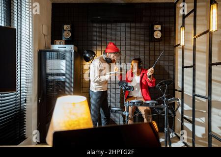 Men playing electric drums at home sstudio Stock Photo