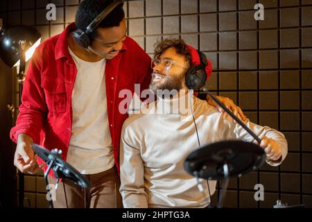 Men playing electric drums at home sstudio Stock Photo