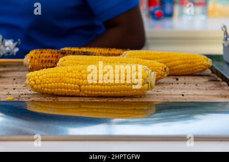 boiled corn is fried in a kiosk Stock Photo