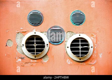 Venting on colored plaster wall with copy space Stock Photo