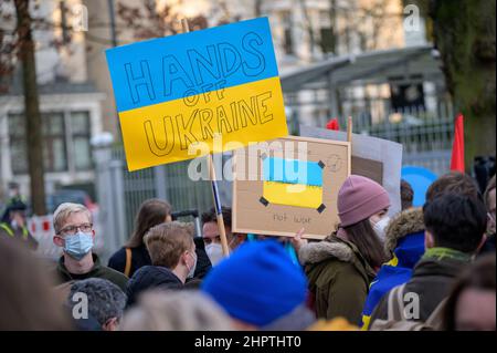 Hamburg, Germany. 23rd Feb, 2022. Demonstrators display placards reading, among other things, 'Hands off Ukraine'. According to police, around 200 people gathered in front of the Russian Consulate General in Hamburg on Wednesday for a solidarity rally with Ukraine. The Hamburg youth organizations of the SPD, the Greens, the CDU and the FDP had called for the rally. Credit: Jonas Walzberg/dpa/Alamy Live News Stock Photo