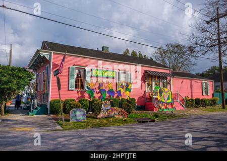 NEW ORLEANS, LA, USA - FEBRUARY 22, 2022: Side view of shotgun house with Bollywood-themed Mardi Gras decorations Stock Photo