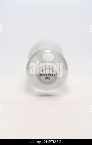 A single use bottle showing cap that has recycle me printed on to it and 50% recycled bottle photographed on a white background. Stock Photo