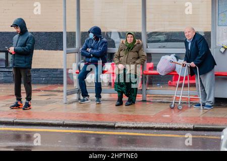Street photography, people waiting for a bus in Green Street, Upton Park, Newham, London Stock Photo