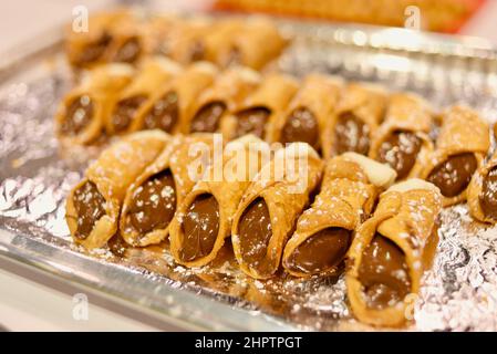 Nutella and cream-filled Italian Sicilian cannoli, tube-shaped deep fried pastry dough, on display at the National Restaurant Show in Chicago Stock Photo