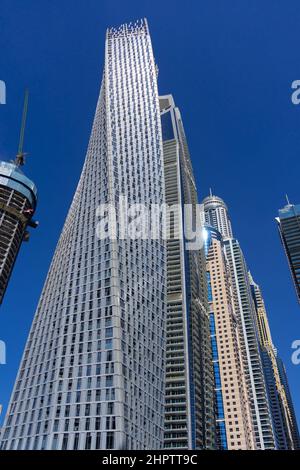 Dec 05 2021 - Dubai, UAE: The twisted Cayan Tower at Marina Bay, shot from below