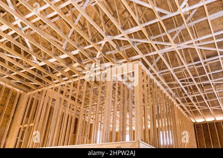 Wooden beams the roof of a private house without unfinishing inside Stock Photo
