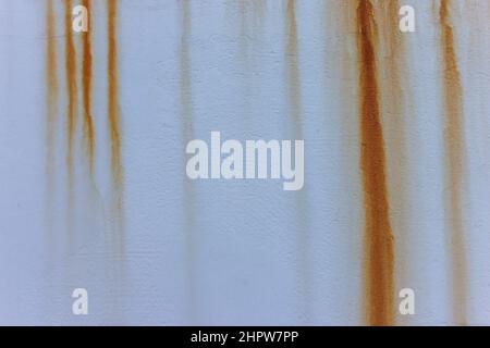 grey cement wall with red rust dripping down Stock Photo