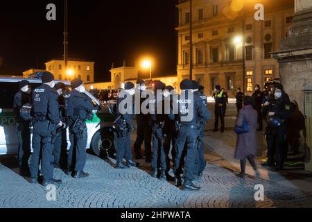 Munich, Germany. 23rd Feb, 2022. Police blocking the road. On February 23, 2022, hundreds of anti-vaxxers gathered to demonstrate against mandatory vaccination and covid protection measures. They lined up between the Geschwister-Scholl-Platz and Odeonsplatz to form a chain of lights. The mask obligation and distance rules were hardly kept. (Photo by Alexander Pohl/Sipa USA) Credit: Sipa USA/Alamy Live News Stock Photo