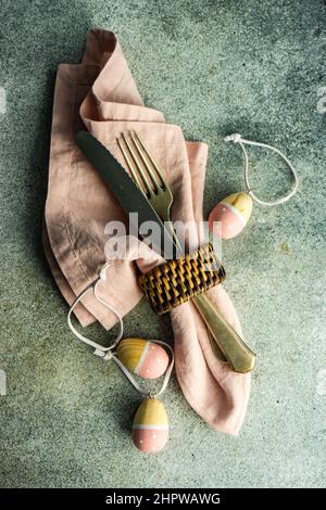 Easter dinner place setting on concrete background Stock Photo