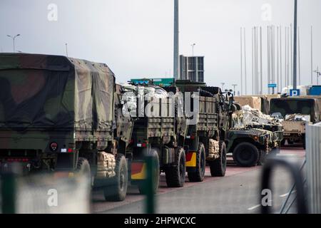 Jasionka, Poland. 23rd Feb, 2022. US Army trucks are seen in a military base in Jasionka.American soldiers arrived in Poland after Pentagon announced additional forces needed. They moved from the United States to Europe, to strengthen NATO's eastern flank. US soldiers from the 82nd Airborne Division created a small military base and a storage for their equipment next to the airport in Jesionka, southern Poland. Credit: SOPA Images Limited/Alamy Live News Stock Photo