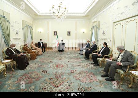 Tehran, Tehran, Iran. 23rd Feb, 2022. A handout picture provided by the Iranian presidency shows the Islamic republic's President EBRAHIM RAISI (C) during a meeting with Oman's Foreign Minister SAYYID BADR AL-BUSAIDI in Tehran on February 23, 2022. Oman has often acted as a go-between to help facilitate back-door diplomacy between the U.S. and Iran, and the visit raised speculation that Oman may get involved as an intermediary in the ongoing nuclear talks, or deliver a U.S. message to Iran. (Credit Image: © Iranian Presidency via ZUMA Press Wire) Stock Photo