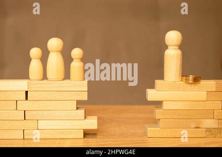 Divorce and divide concept. Models of family with child and house close-up Stock Photo