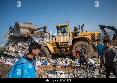 Beirut, Lebanon. 18th Feb, 2022. Day laborers collect recyclable items at a landfill. In the midst of Lebanon's worst economic crisis, the waste management industry is threatened with a new low. (to dpa: 'Economic crisis in Lebanon - the poorest fight for the garbage ') Credit: Arne Bänsch/dpa/Alamy Live News Stock Photo