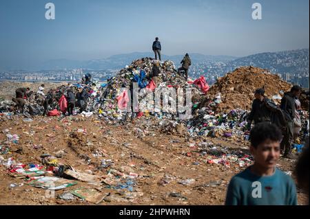 Beirut, Lebanon. 18th Feb, 2022. Day laborers collect recyclable items at a landfill. In the midst of Lebanon's worst economic crisis, the waste management industry is threatened with a new low. (to dpa: 'Economic crisis in Lebanon - the poorest fight for the garbage ') Credit: Arne Bänsch/dpa/Alamy Live News Stock Photo