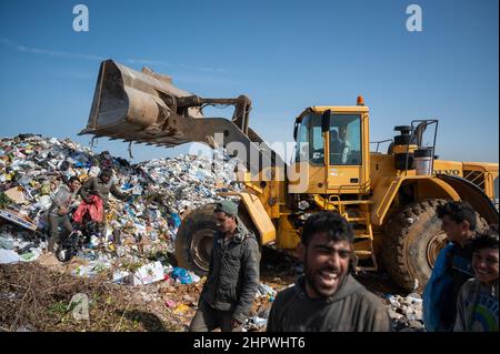 Beirut, Lebanon. 18th Feb, 2022. Day laborers collect recyclable items at a landfill. In the midst of Lebanon's worst economic crisis, the waste management industry is threatened with a new low. (to dpa: 'Economic crisis in Lebanon - the poorest struggle for garbage') Credit: Arne Bänsch/dpa/Alamy Live News Stock Photo