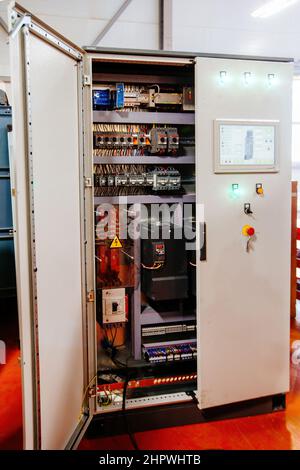 Electrical switch panel in opened switchgear cabinet. Stock Photo