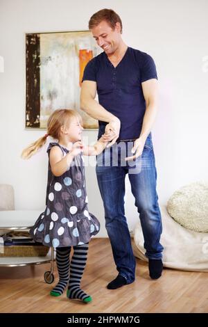 Father-daughter bonding. Shot of a young father bonding with his little daughter. Stock Photo