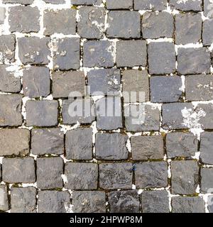 Pattern Of Wet Cobble Stone With Sparse Light Stock Photo - Alamy