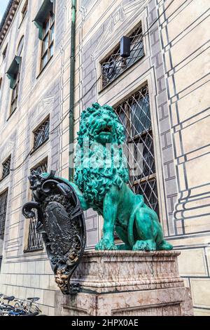 bavarian lion statue in front of residence palace at odeonsplatz, old town munich. Selective focus. Stock Photo
