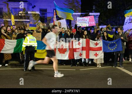 London, UK, 23rd Feb, 2022, Hundreds of protesters, some bearing flags from other nations stand in solidarity with Ukraine. They gathered outside the Russian Embassy amid fears Moscow is planning an invasion after rising tension and over 150,000 troops were deployed near the border with Ukraine. Organisers of the rally - London Euromaidan, call for tougher sanctions against supporters and companies of Russian president Vladamir Putin. Credit: Eleventh Hour Photography/Alamy Live News Stock Photo