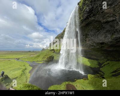 Beautiful view of a waterfall from a cliff under the clear sky Stock Photo