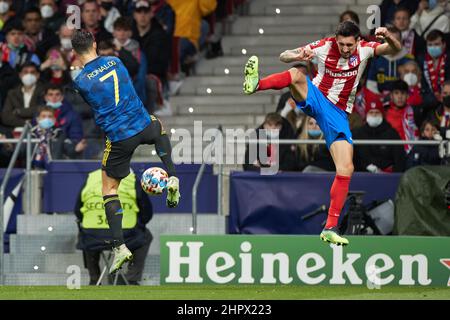 Madrid. 23rd Feb, 2022. Atletico de Madrid's Stefan Savic (R) vies with Manchester United's Cristiano Ronaldo during the UEFA Champions League round of 16 first leg match between Atletico de Madrid and Manchester United in Madrid, Spain, Feb.23, 2022. Credit: Meng Dingbo/Xinhua/Alamy Live News Stock Photo